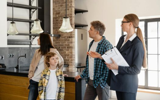 A family converses with a real estate agent about a modern home interior.