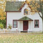 white house under maple trees