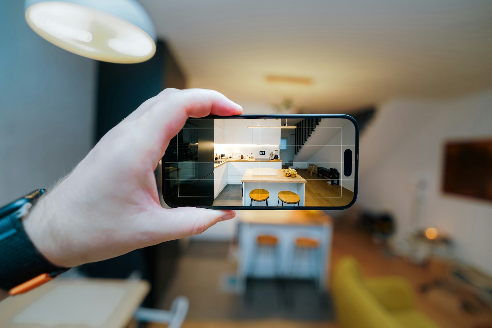 A person taking a picture of a living room